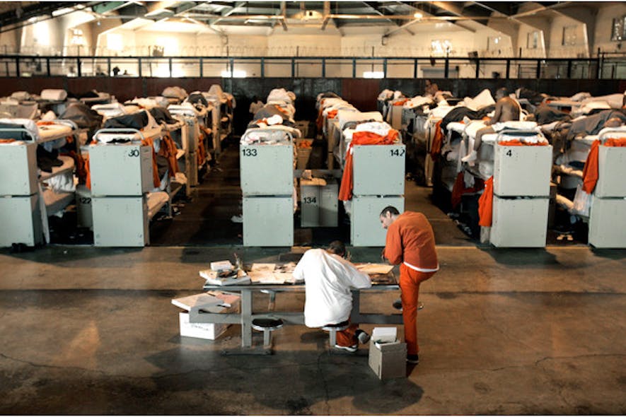 Inmates are housed in three tier bunks, in what was once a multi-purpose recreation room, at the Deuel Vocational Institute in Tracy, Calif.