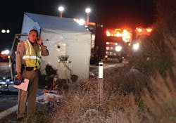 A California Highway Patrol officer stands in front of an overturned trailer after a crash that resulted in eight fatalities. A California Highway Patrol officer stands in front of an overturned trailer after a crash that resulted in eight fatalities.