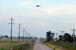 Law enforcement officials are seen gathered on a county road northwest of Imperial, Neb. on Aug. 25. Law enforcement officials are seen gathered on a county road northwest of Imperial, Neb. on Aug. 25.