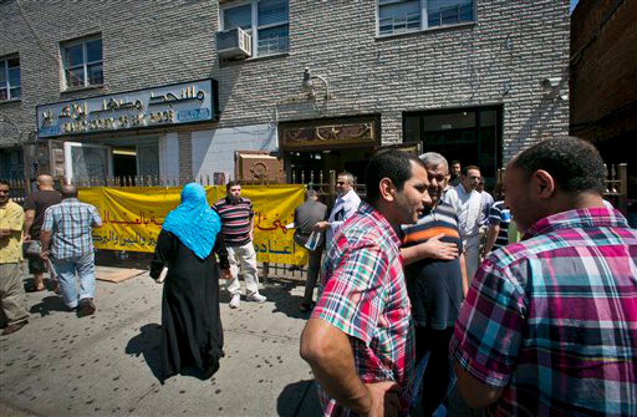 Visitors socialize outside the Islamic Society of Bay Ridge and mosque, after a Jumu'ah prayer service on Aug. 16 in Brooklyn.
