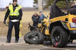 A Lake County Sheriff's Police investigator examines a vehicle involved on April 5 in an accident with a school bus near Zion, Ill. A Lake County Sheriff's Police investigator examines a vehicle involved on April 5 in an accident with a school bus near Zion, Ill.