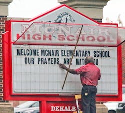 A McNair High school staff member works on a welcome sign for Ronald E. McNair Discovery Learning Academy students on Aug. 21. A McNair High school staff member works on a welcome sign for Ronald E. McNair Discovery Learning Academy students on Aug. 21.