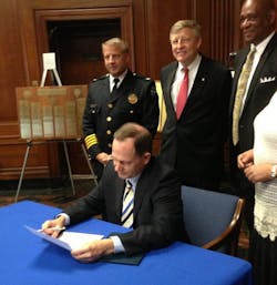 St. Louis Mayor Francis Slay signs an executive order accepting control of its police department from the state after 152 years of oversight.