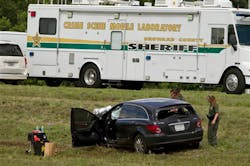 Police investigate the vehicle of a suspect who police say is responsible for the deaths of three people after leading police on a high speed chase on Sept. 18 in Broward County, Fla. Police investigate the vehicle of a suspect who police say is responsible for the deaths of three people after leading police on a high speed chase on Sept. 18 in Broward County, Fla.