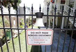 A sign in the yard of the Victorian home of convicted killer Dorothea Puente makes reference to Puente&apos;s victims, who were buried in the home&apos;s yard in Sacramento, Calif.