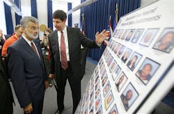 United States attorney for the Northern District Steven M. Dettelbach, right, and Cleveland Mayor Frank Jackson, left, look over the photographs of people indicted for heroin on Sept. 18 Cleveland. United States attorney for the Northern District Steven M. Dettelbach, right, and Cleveland Mayor Frank Jackson, left, look over the photographs of people indicted for heroin on Sept. 18 Cleveland.