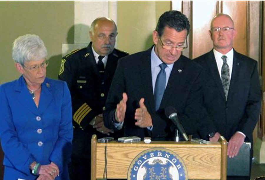 Connecticut Gov. Dannel P. Malloy, at podium, announces $5 million in state grants for school security upgrades on Sept. 18 in Hartford, Conn.