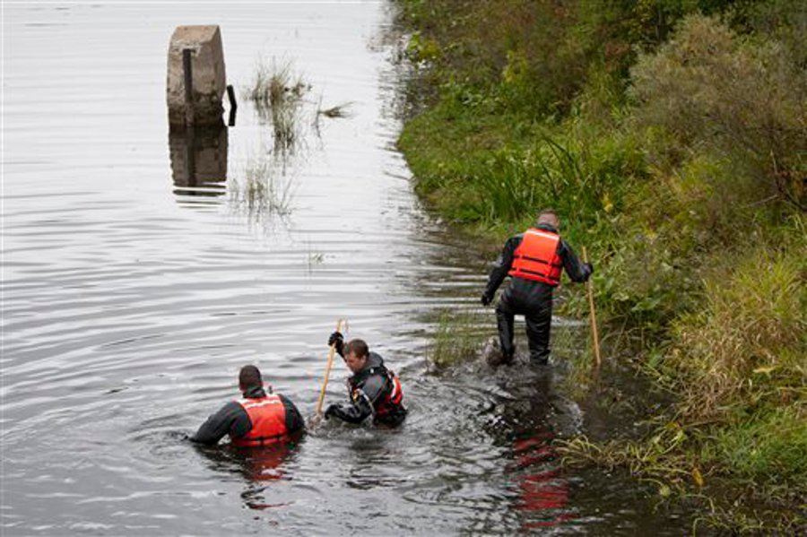 Authorities search the Flat River, near the Ashfield Street bridge, for Devon Morrison, 10, in Belding, Mich. on Sept. 16.