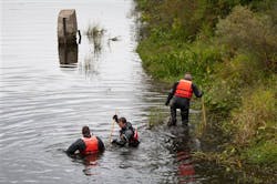 Authorities search the Flat River, near the Ashfield Street bridge, for Devon Morrison, 10, in Belding, Mich. on Sept. 16. Authorities search the Flat River, near the Ashfield Street bridge, for Devon Morrison, 10, in Belding, Mich. on Sept. 16.