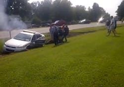 A group of bystanders pulled a Wilson's Mills, N.C. police officer from his cruiser on Sept. 1 after the vehicle wound up in a ditch before catching fire. A group of bystanders pulled a Wilson's Mills, N.C. police officer from his cruiser on Sept. 1 after the vehicle wound up in a ditch before catching fire.