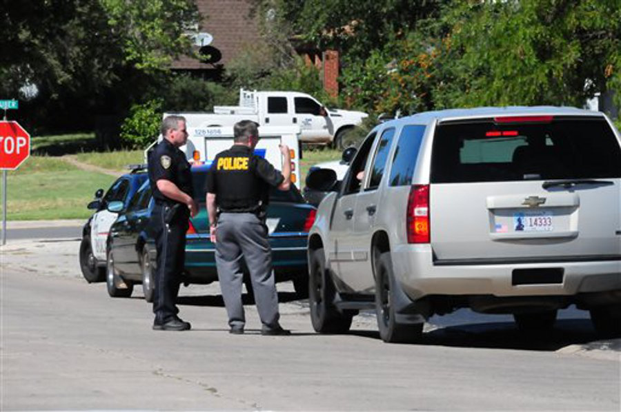 Weatherford Police direct cars away from schools as they tell parents the schools were on lock down on Sept. 24 in Weatherford, Okla.