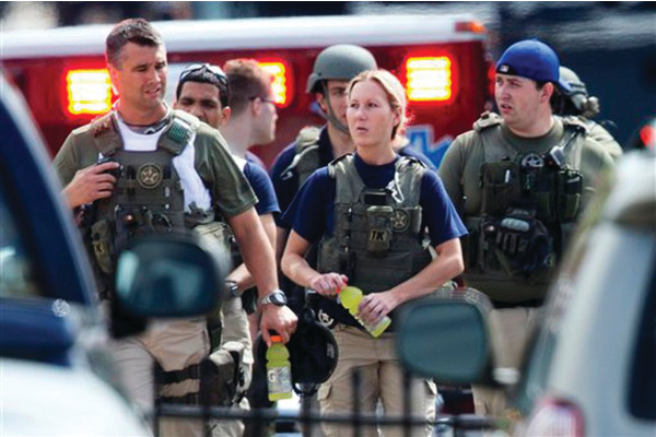 Police officers who responded to the deadly Navy Yard shooting on Sept. 16 in Washington, D.C. leave the facility.