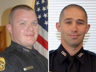 Officers David Curtis, left, and Jeffrey Kocab