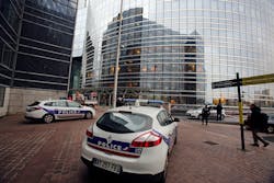 Police cars park near the entrance of the Societe General Bank headquarters in La Defense business district, west of Paris on Nov. 18. Police cars park near the entrance of the Societe General Bank headquarters in La Defense business district, west of Paris on Nov. 18.