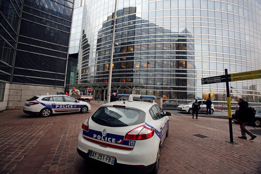 Police cars park near the entrance of the Societe General Bank headquarters in La Defense business district, west of Paris on Nov. 18.