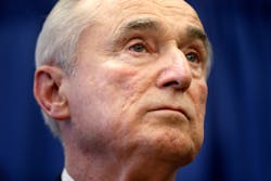 William Bratton listens during a news conference in New York on Dec. 5.