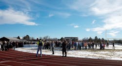 Sheriffs deputies stand guard over students after they were evacuated to the track and football field at Arapahoe High School in Centennial, Colo. on Dec. 13. Sheriffs deputies stand guard over students after they were evacuated to the track and football field at Arapahoe High School in Centennial, Colo. on Dec. 13.