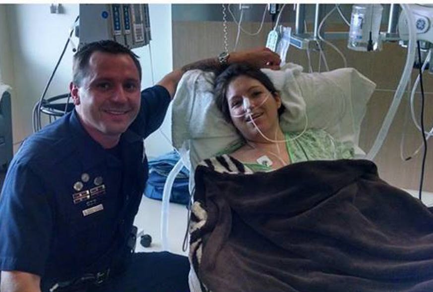 Denver Police Officer Dwayne Huddleston is shown with Alexis Davis at the hospital.