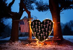 A makeshift memorial with crosses for the victims of the Sandy Hook massacre stands outside a home in Newtown, Conn. on the one-year anniversary of the shootings. A makeshift memorial with crosses for the victims of the Sandy Hook massacre stands outside a home in Newtown, Conn. on the one-year anniversary of the shootings.