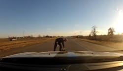 Dashcam video shows Evansville Sgt. Jason Cullum traveling on I-164 when he stopped his cruiser to retrieve a young girl&apos;s teddy bear from the road.