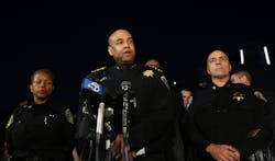 Bay Area Rapid Transit police Chief Kenton Rainey, center, speaks to the media outside Eden Medical Center in Castro Valley, Calif. on Jan. 21.