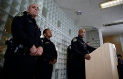 Bay Area Rapid Transit Police Chief Kenton Rainey, at podium, answers questions about the shooting of a BART officer who was killed by a fellow officer during a news conference on Jan. 22 in Oakland, Calif.