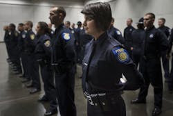 Emily Kane prepares for the Sacramento Police Department graduation ceremony at the Convention Center in Sacramento, Calif., on Dec. 19. Emily Kane prepares for the Sacramento Police Department graduation ceremony at the Convention Center in Sacramento, Calif., on Dec. 19.