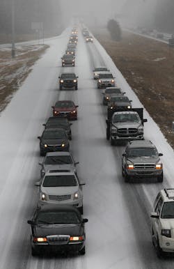 Vehicles moves slowly in Georgia on Jan. 28 after a snowstorm hit the area.