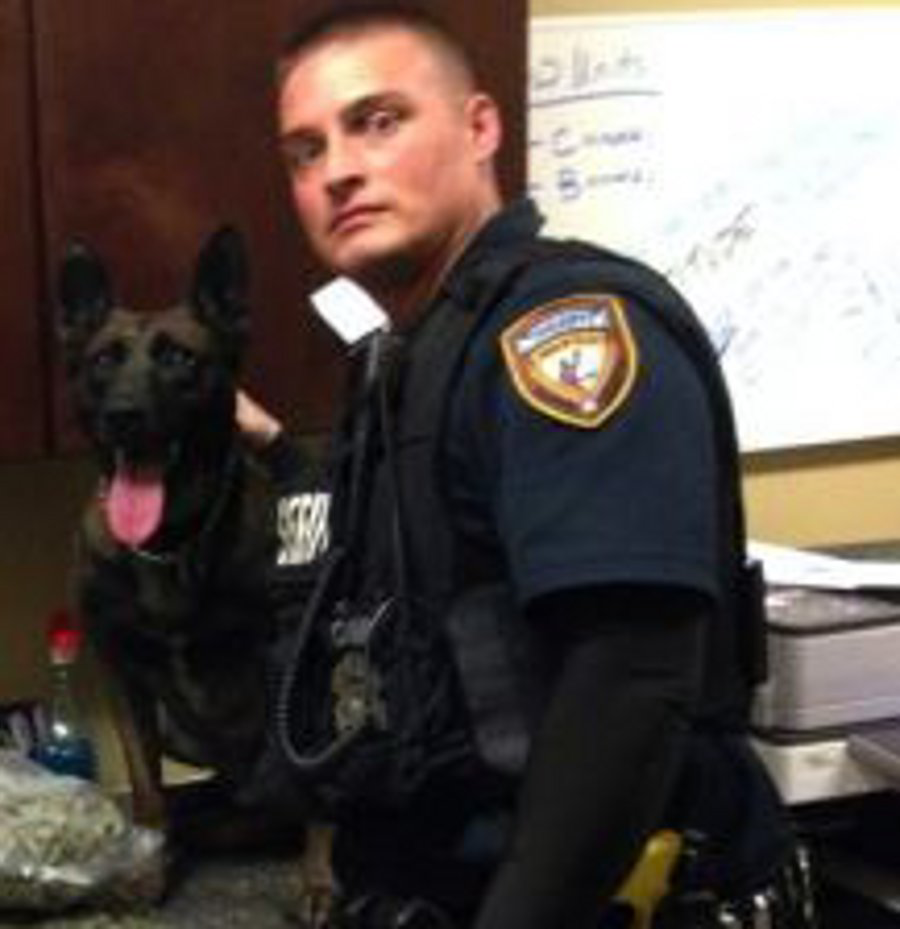 Deputy Jason Denham is seen with his K-9 partner Sjors.