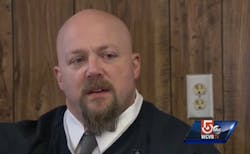 Lawrence Police Officer Carl Farrington carried a man out of a smoky building Monday night. Lawrence Police Officer Carl Farrington carried a man out of a smoky building Monday night.