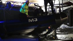 A diver and a police officer from the Chicago Marine Unit work at a rescue scene on the Chicago River, about 100 yards west of Lake Shore Drive on Jan. 13. A diver and a police officer from the Chicago Marine Unit work at a rescue scene on the Chicago River, about 100 yards west of Lake Shore Drive on Jan. 13.