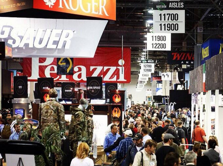 Attendees are seen on the floor of SHOT Show 2014 in Las Vegas, Nev. on Jan. 14.