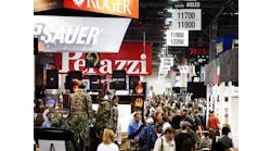 Attendees are seen on the floor of SHOT Show 2014 in Las Vegas, Nev. on Jan. 14.