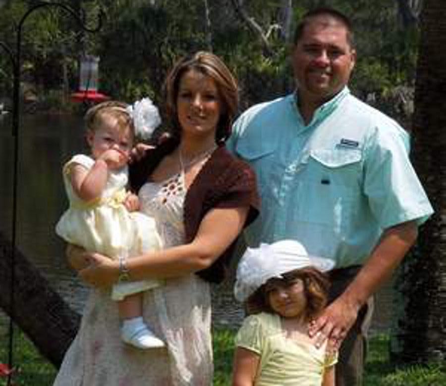 Taylor County Deputy Robert Lundy, right, with his wife Kelly and their two daughters, Emily and Allison