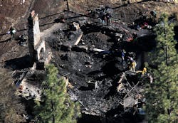 Investigators process the scene in a charred cabin in Big Bear Lake on Feb. 13, 2013, where fugitive ex-LAPD officer Christopher Dorner was holed up after trading gunfire with officers. Investigators process the scene in a charred cabin in Big Bear Lake on Feb. 13, 2013, where fugitive ex-LAPD officer Christopher Dorner was holed up after trading gunfire with officers.