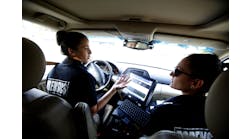 Christina Pino, right, and Gabrielle Wimer, Forensic ID Specialists with the Torrance, Calif., Police Department, drive to a burglary scene on Dec. 3.