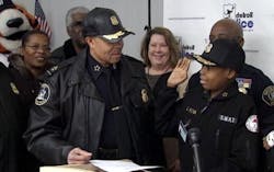 Jayvon Felton, a 9-year-old with acute lymphoblastic leukemia, is seen next to Detroit Police Chief James Craig on Jan. 31 at Public Safety Headquarters.