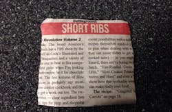 A newspaper clipping describing a recipe for short ribs landed a man in jail after he pasted the square piece of paper onto his windshield and tried to pass it off as an inspection sticker.