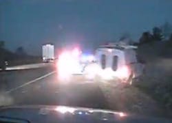 The law officers were working on another crash when a semi struck the pick-up and sent it flying between the sheriff's vehicle and a state patrol car. The law officers were working on another crash when a semi struck the pick-up and sent it flying between the sheriff's vehicle and a state patrol car.