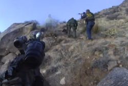 Footage released Friday shows part of a five-hour standoff and eventual shooting of an illegal camper.