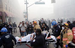 Rescue workers remove an injured person on a stretcher after a possible explosion and building collapse in the East Harlem neighborhood of New York on March 12. Rescue workers remove an injured person on a stretcher after a possible explosion and building collapse in the East Harlem neighborhood of New York on March 12.