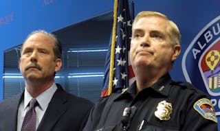 Albuquerque Mayor Richard Berry, left, and Police Chief Gorden Eden speak to reporters on April 10 after the U.S. Justice Department released a report in response to a series of deadly Albuquerque police shootings.