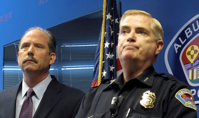 Albuquerque Mayor Richard Berry, left, and Police Chief Gorden Eden speak to reporters on April 10 after the U.S. Justice Department released a report in response to a series of deadly Albuquerque police shootings.