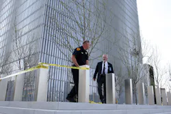 A Salt Lake City police officer puts tape up as US Marshals investigate a shooting in the Federal Courthouse on April 21. A Salt Lake City police officer puts tape up as US Marshals investigate a shooting in the Federal Courthouse on April 21.