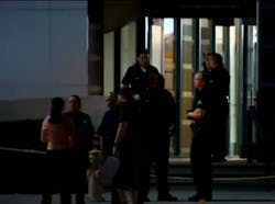 A gunman walked into a Los Angeles Police Department station lobby Monday night and opened fire, wounding one officer in an exchange of gunfire.