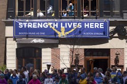 Spectators watch runners during the 118th Boston Marathon on April 21. Spectators watch runners during the 118th Boston Marathon on April 21.