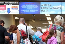 An informational screen, center, warns travelers to not carry weapons through the security checkpoint in this Aug. 29, 2013, file photo at Orlando International Airport. An informational screen, center, warns travelers to not carry weapons through the security checkpoint in this Aug. 29, 2013, file photo at Orlando International Airport.