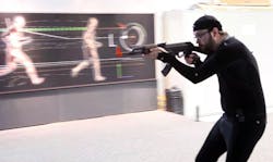 Research technician Max Grattan carries a training gun while wearing a suit fitted with special reflectors that allow three-dimensional recording of his movements at the Air Force Research Laboratory at Wright-Patman Air Force Base in Dayton, Ohio. Research technician Max Grattan carries a training gun while wearing a suit fitted with special reflectors that allow three-dimensional recording of his movements at the Air Force Research Laboratory at Wright-Patman Air Force Base in Dayton, Ohio.