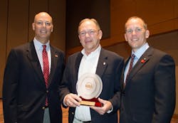 Photo Caption: Frank Brownell (center) is congratulated by Doug Hamlin, Executive Director, NRA Publications (left) and Pete Brownell (right) Photo Caption: Frank Brownell (center) is congratulated by Doug Hamlin, Executive Director, NRA Publications (left) and Pete Brownell (right)