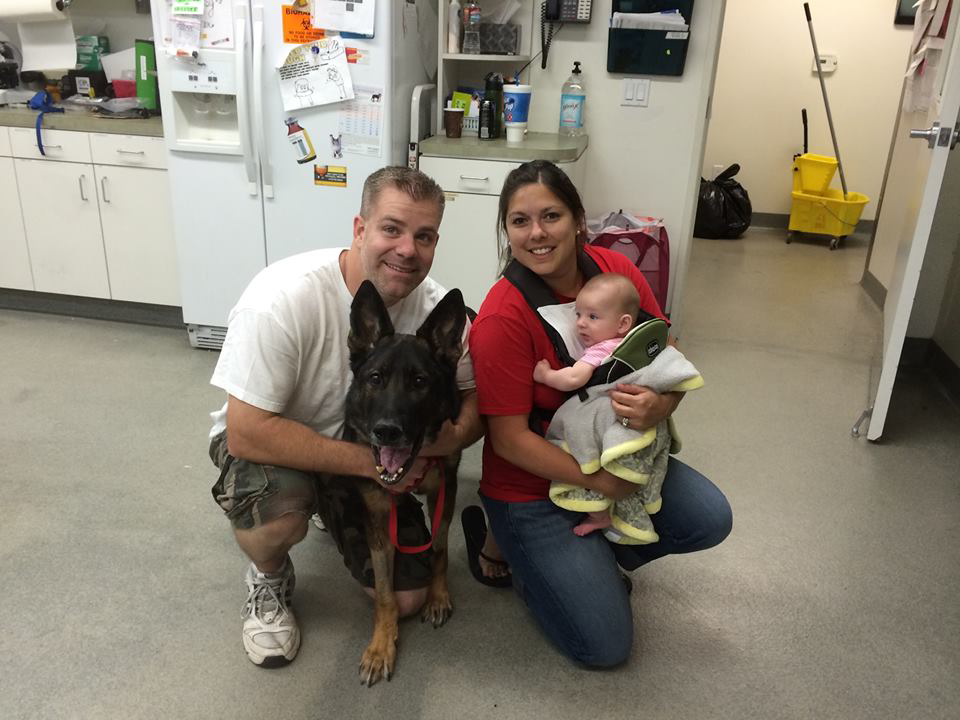 Anaheim Police Officer R.J. Young and his family are seen with K-9 Bruno during a recent visit.